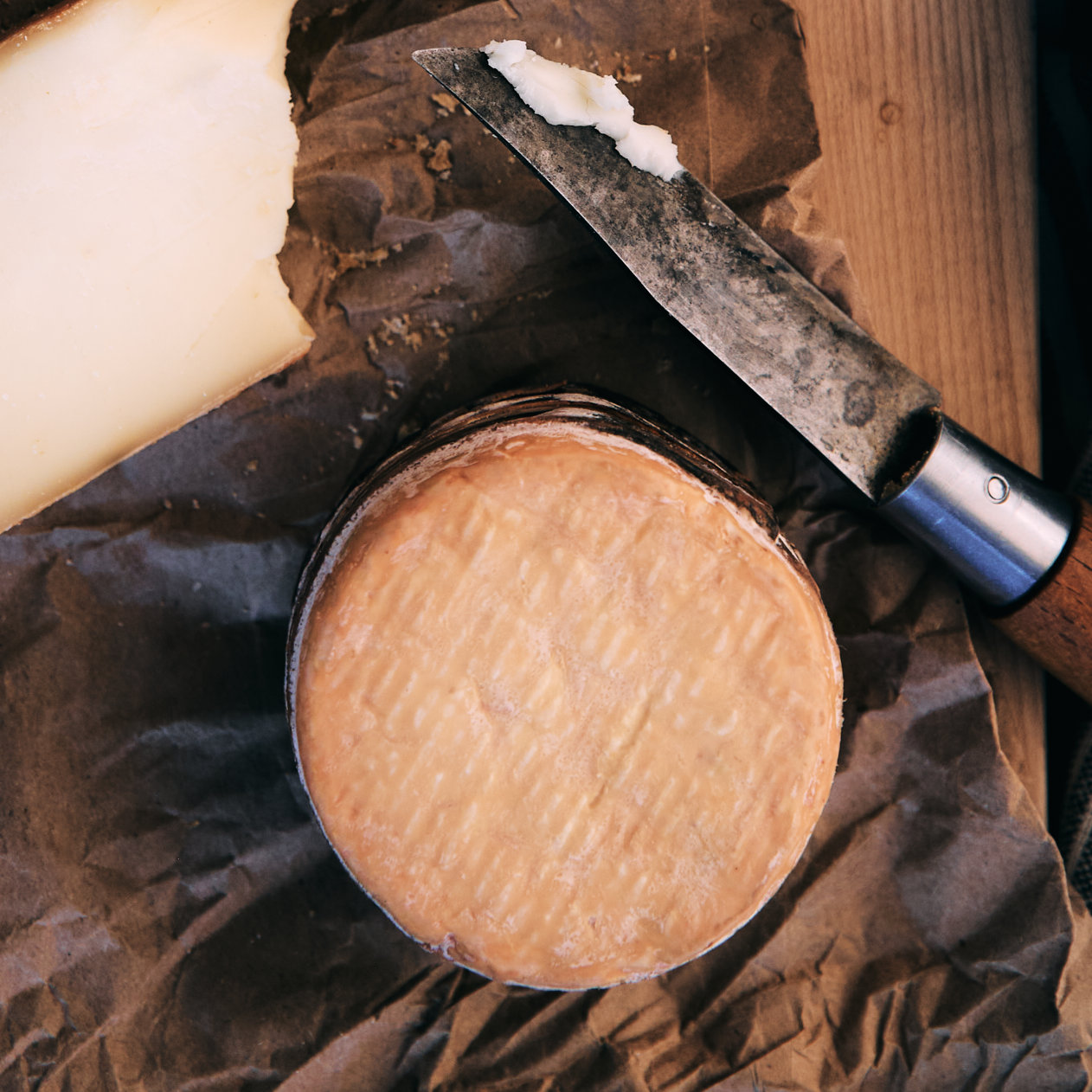 Adoray soft ripened cheese on wrapping paper