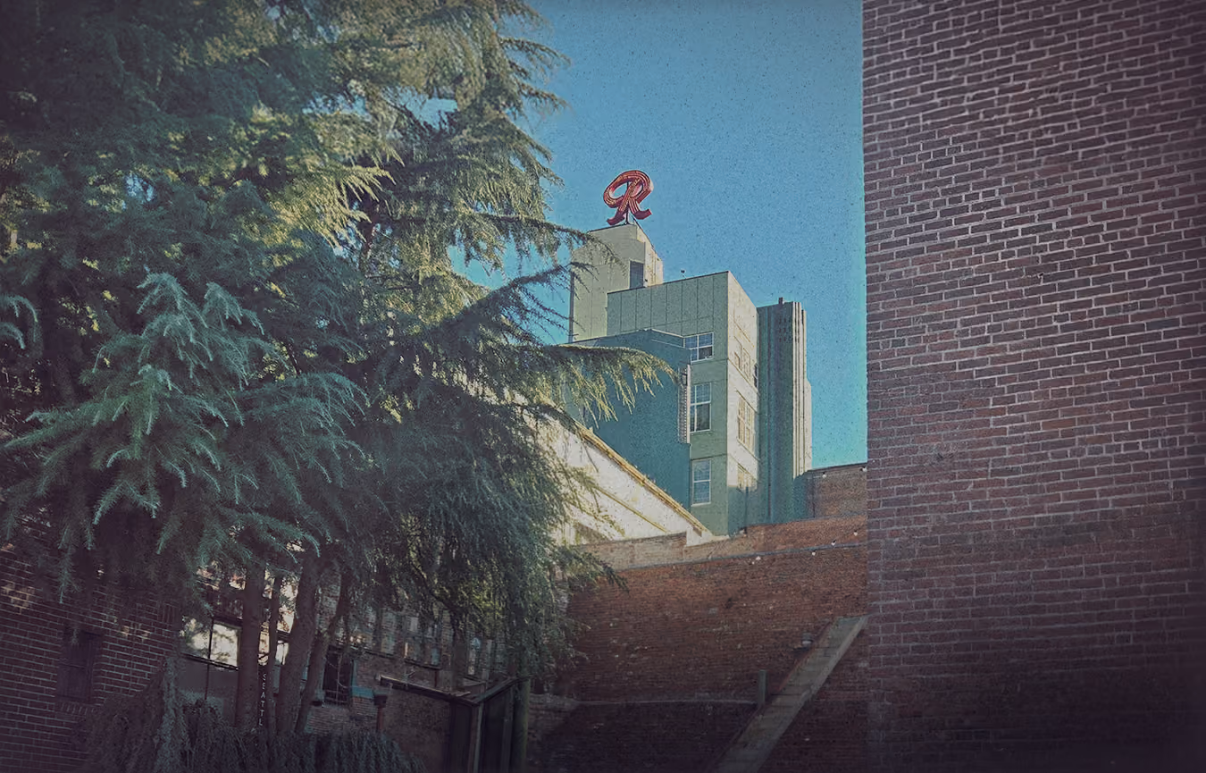 Hero background. A picture of the Old Rainier Brewery. The famous red 'R' is in the distance