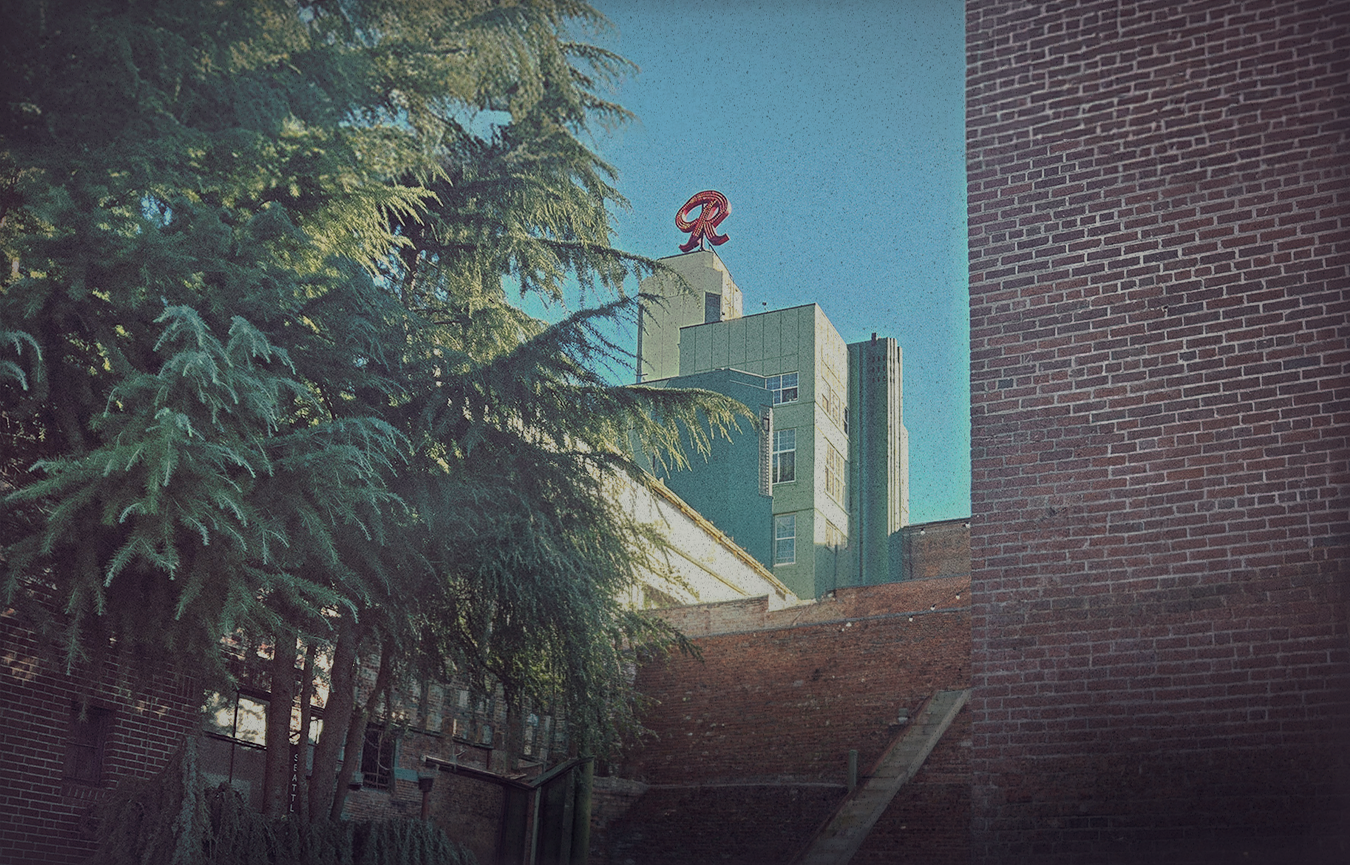 Hero background. A picture of the Old Rainier Brewery. The famous red 'R' is in the distance