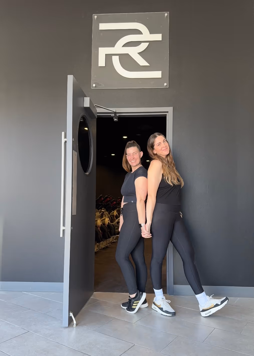 Two women at the studio's entrance