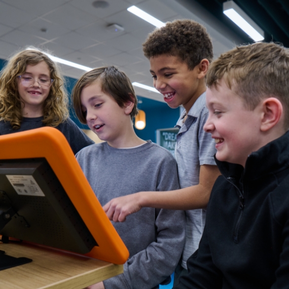 A girl sound asleep next to her Whazoodle speaker