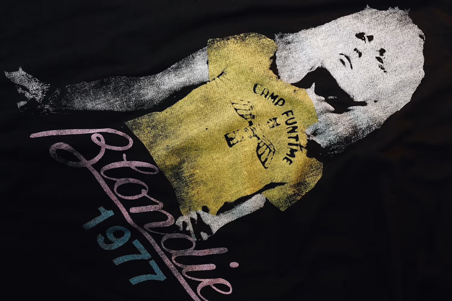 A close-up of a black t-shirt with a vintage distressed Blondie design on the front