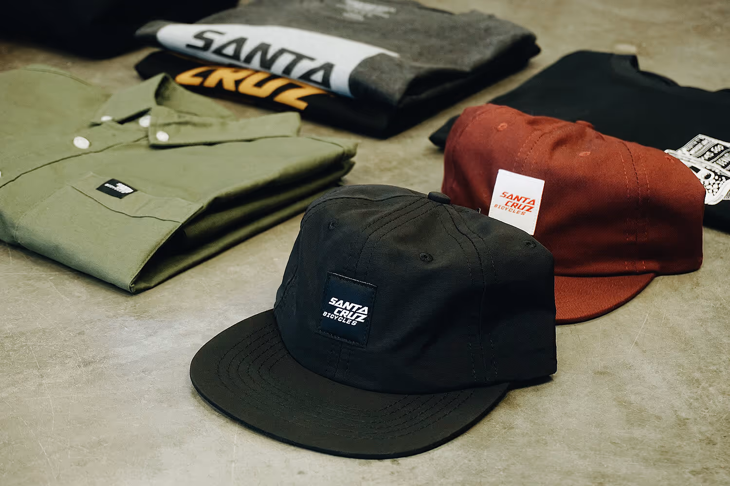 Santa Cruz Bicycles apparel collection featuring branded caps and clothing by Apparel Graphics