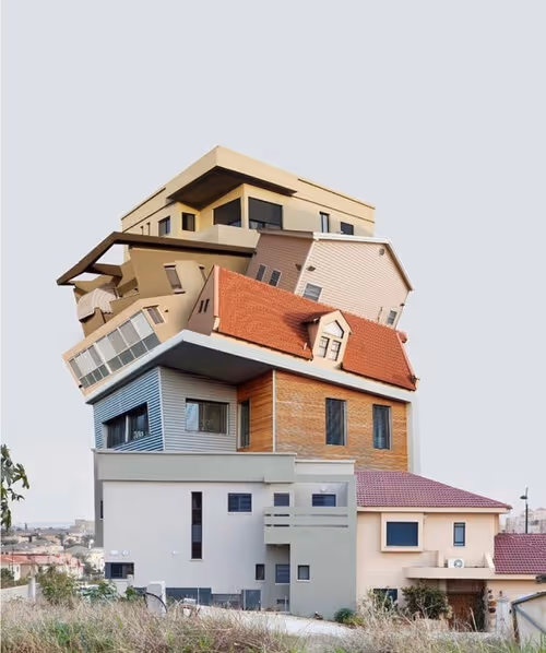 Stacked houses of different styles forming an impossible vertical structure