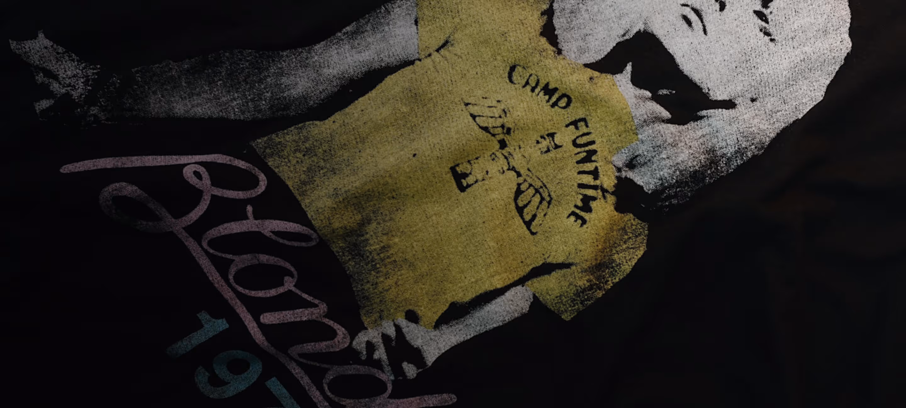 A close-up of a black t-shirt with a vintage distressed Blondie design on the front
