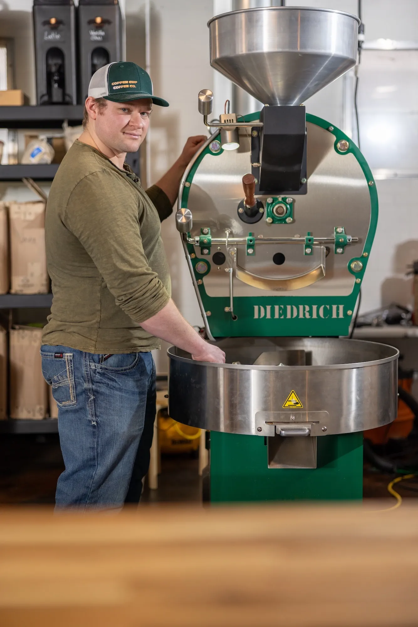 Copper Cup coffee roaster working beside the shop roaster