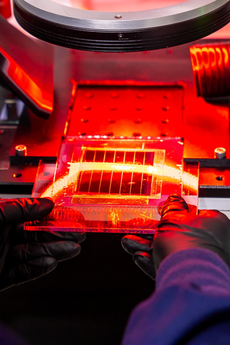 A Halocell staff member using the Laser in our Lab.