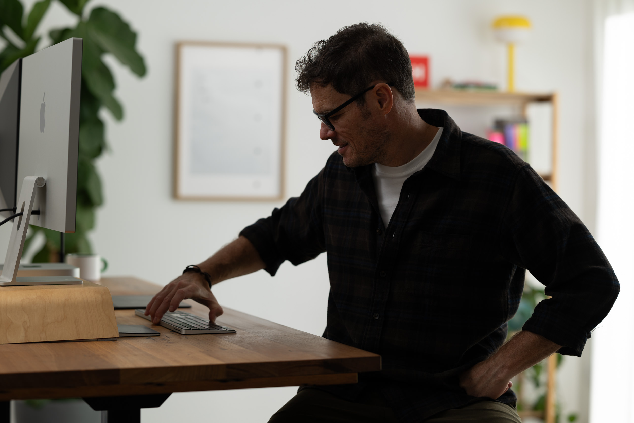 The creative director of Brand New Days working in the studio at his desk