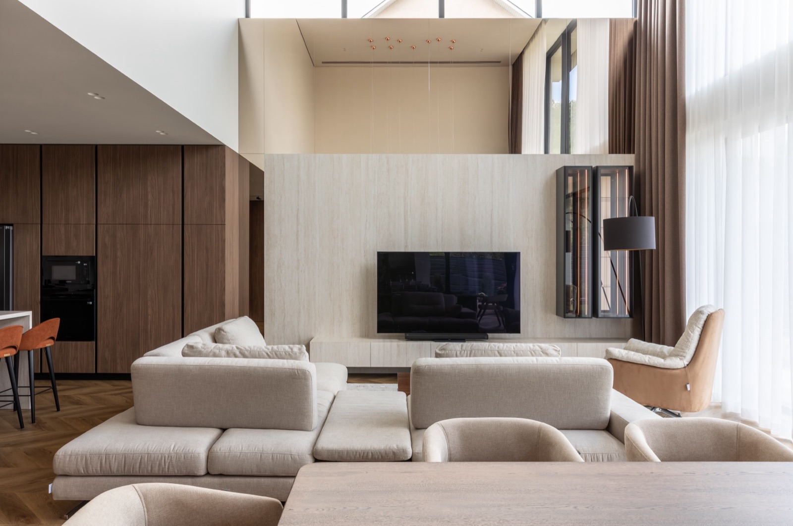 open-plan living room with travertine wall