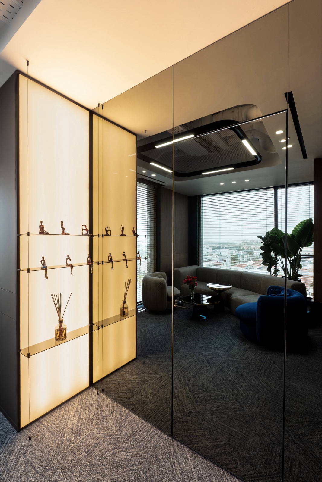 CEO Office interior by COBALT, Paphos, Cyprus - backlit column shelf and mirrored panel