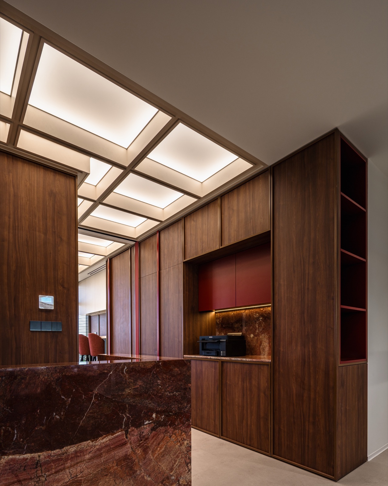 reception with red marble desk