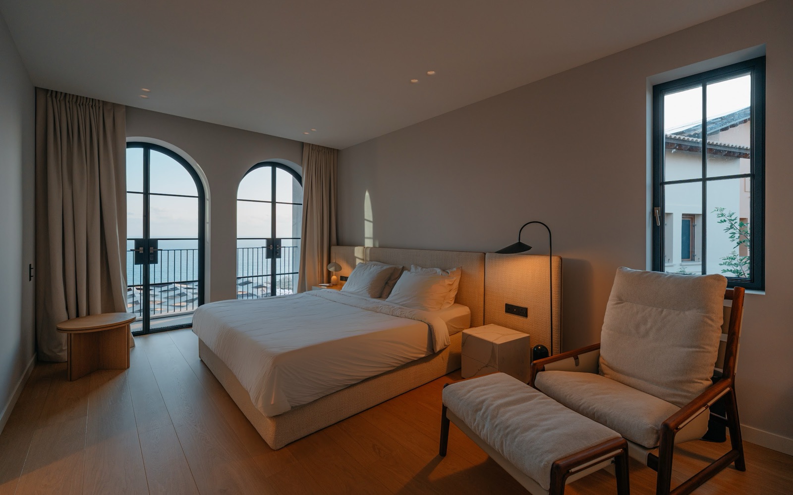 master bedroom with arched windows