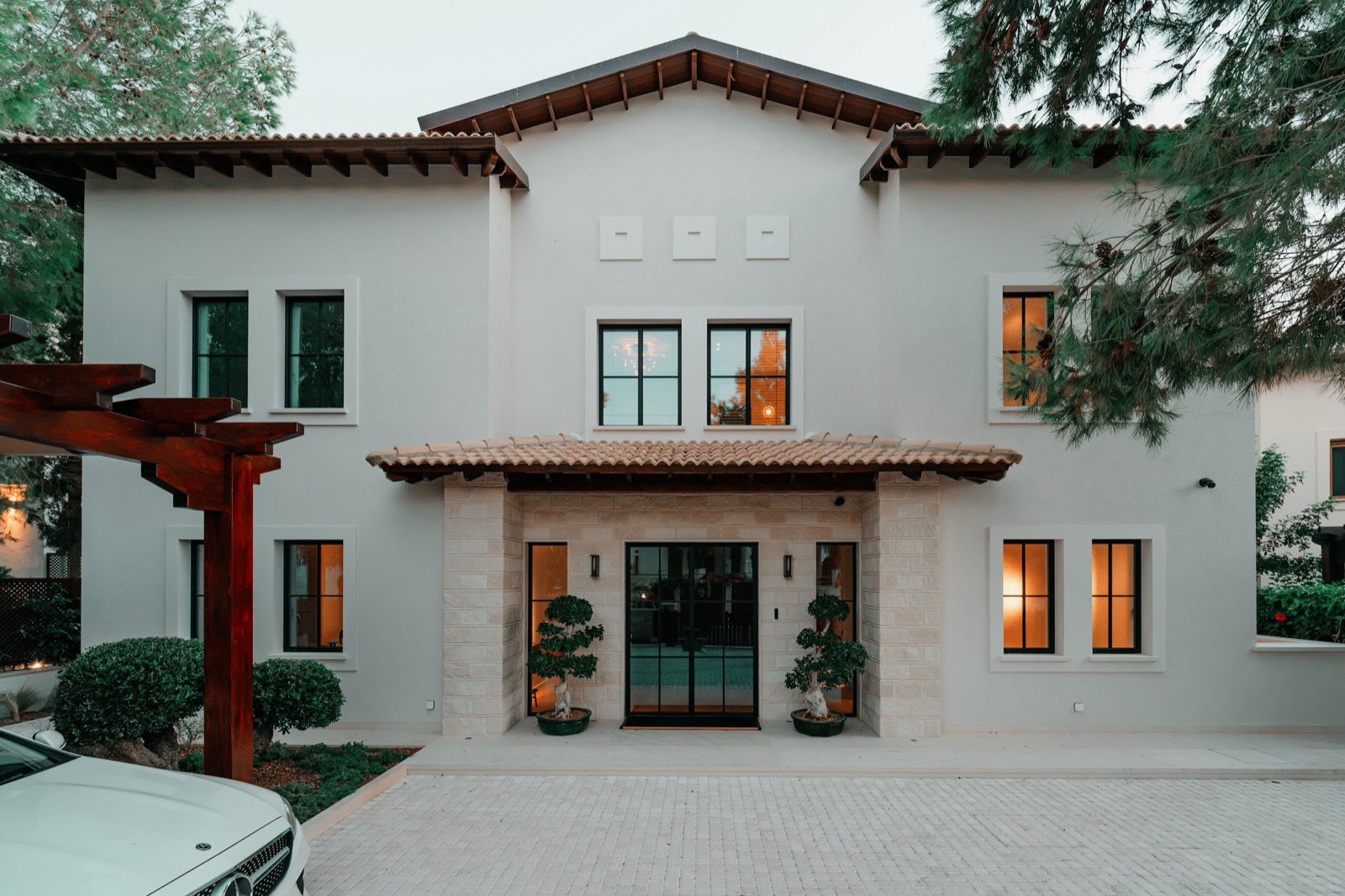 Aphrodite House by COBALT, Aphrodite Hills, Cyprus - facade with arched windows and terracotta roof