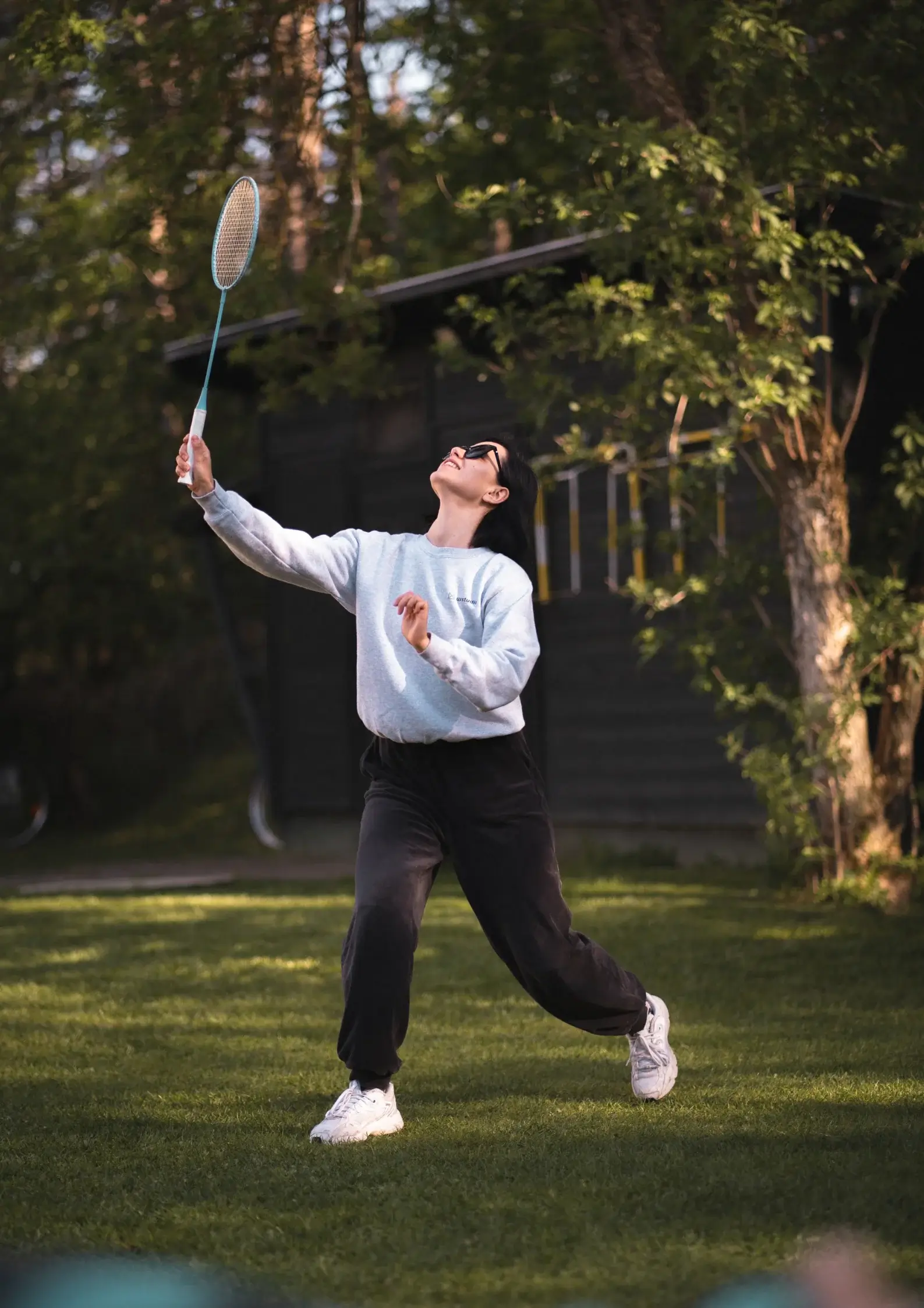 A UX researcher playing tennis at UX studio's company retreat
