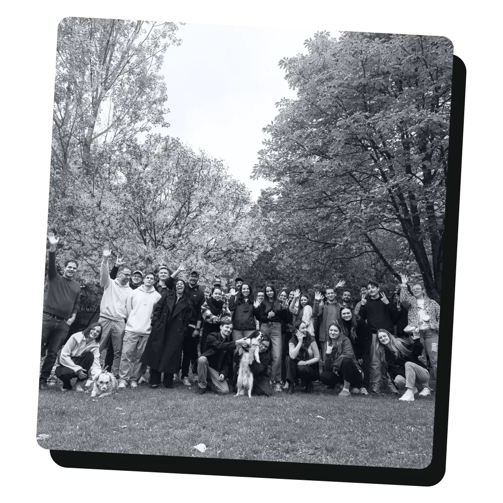 A black and white image of a large group of UX studio employees