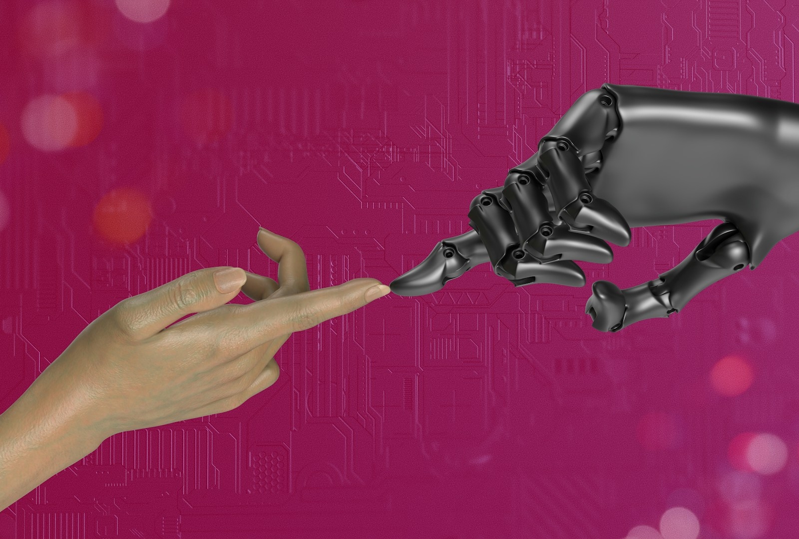 A hand touching a robotic hand.