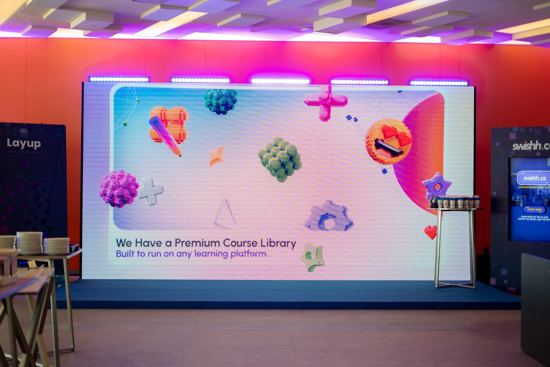 Swishh activation space with the conference display and game stations