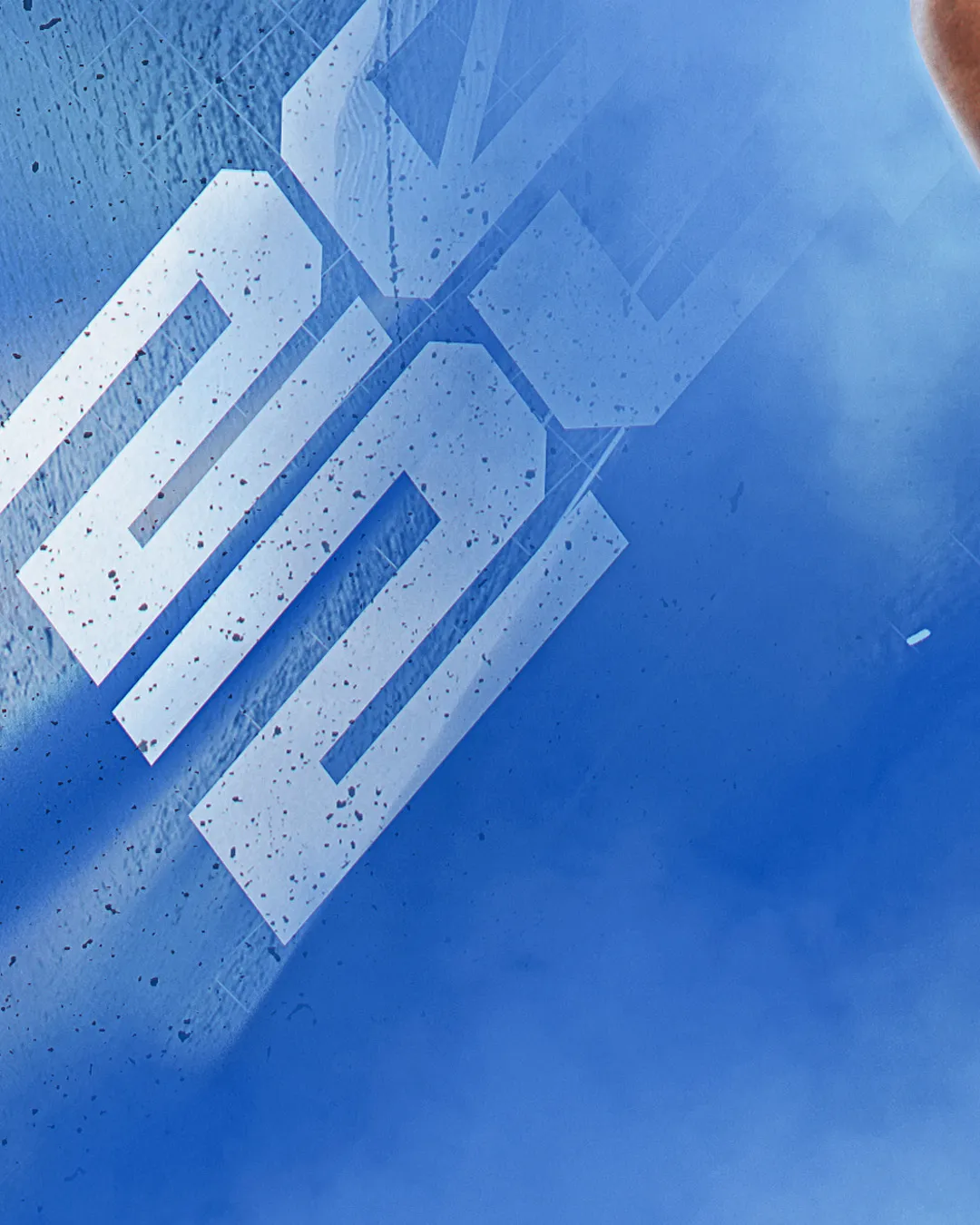 Logo 3x3 en relief sur la texture bleue de l'affiche FFBB