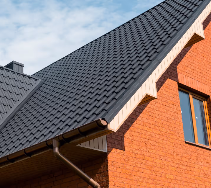 Standing seam metal roof installation on residential home