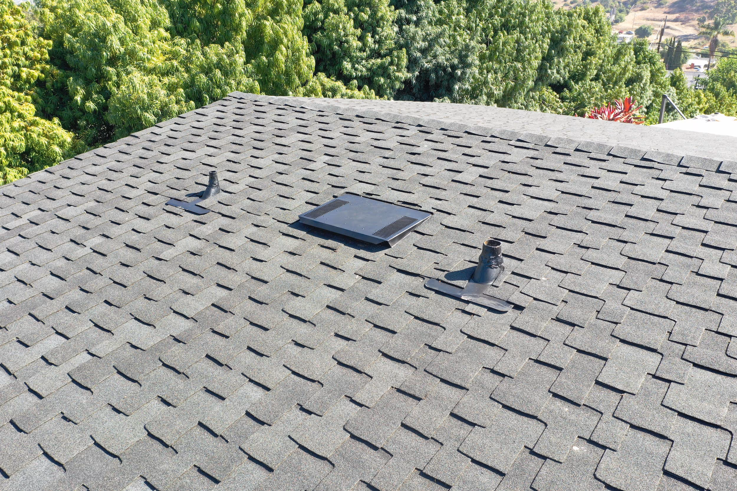 asphalt shingle roof installation with roof vent system