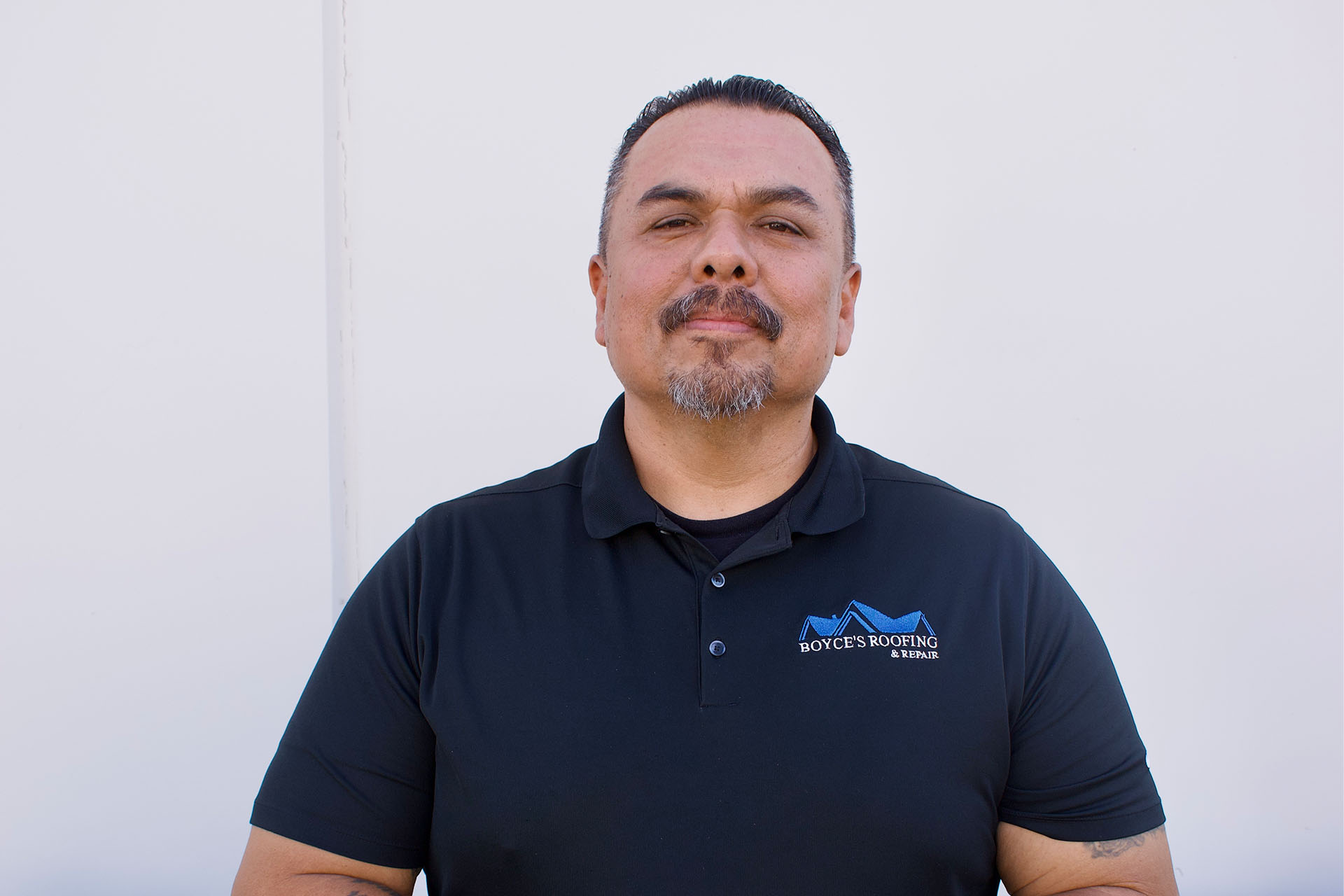 Boyce’s Roofing & Repair team member in company polo