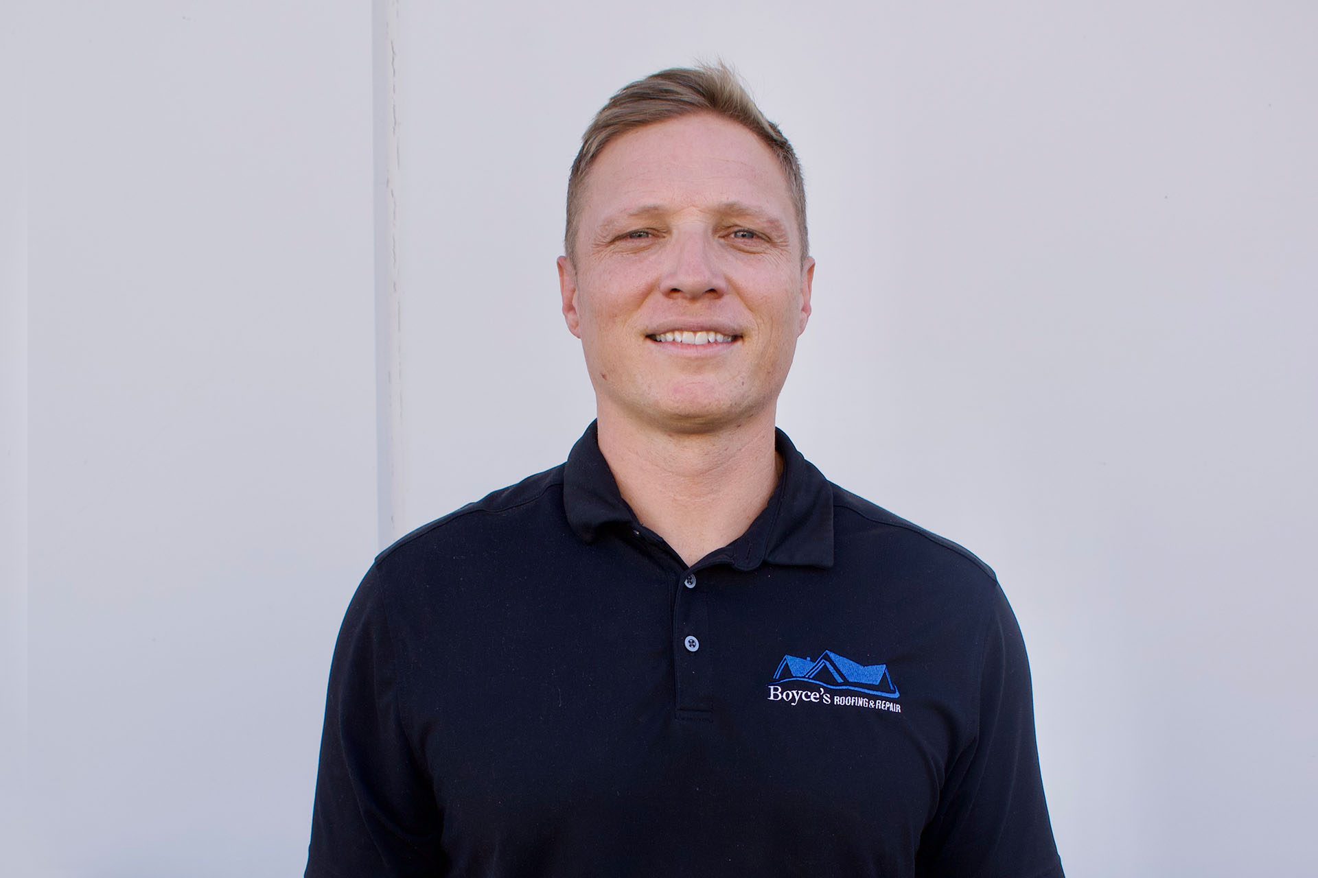 Boyce’s Roofing & Repair team member in company uniform