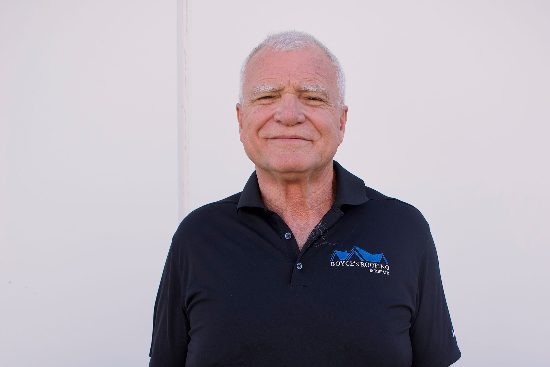 Boyce’s Roofing & Repair owner in company polo shirt
