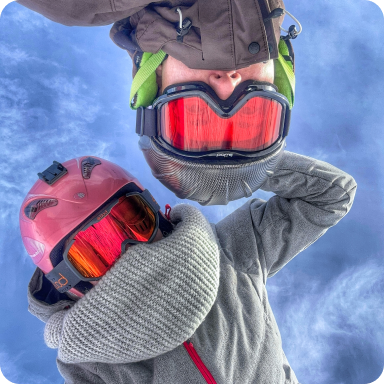 My man and I in ski suits taking selfie