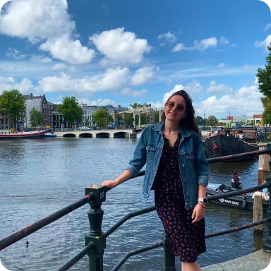 Me posing in front of a river in the Netherlands