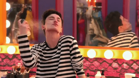 person putting on perfume while saying let's go