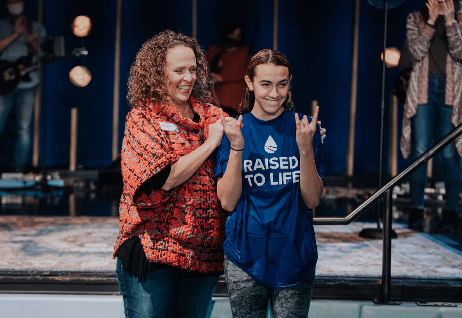 Adyline getting baptized at Fellowship Dallas church