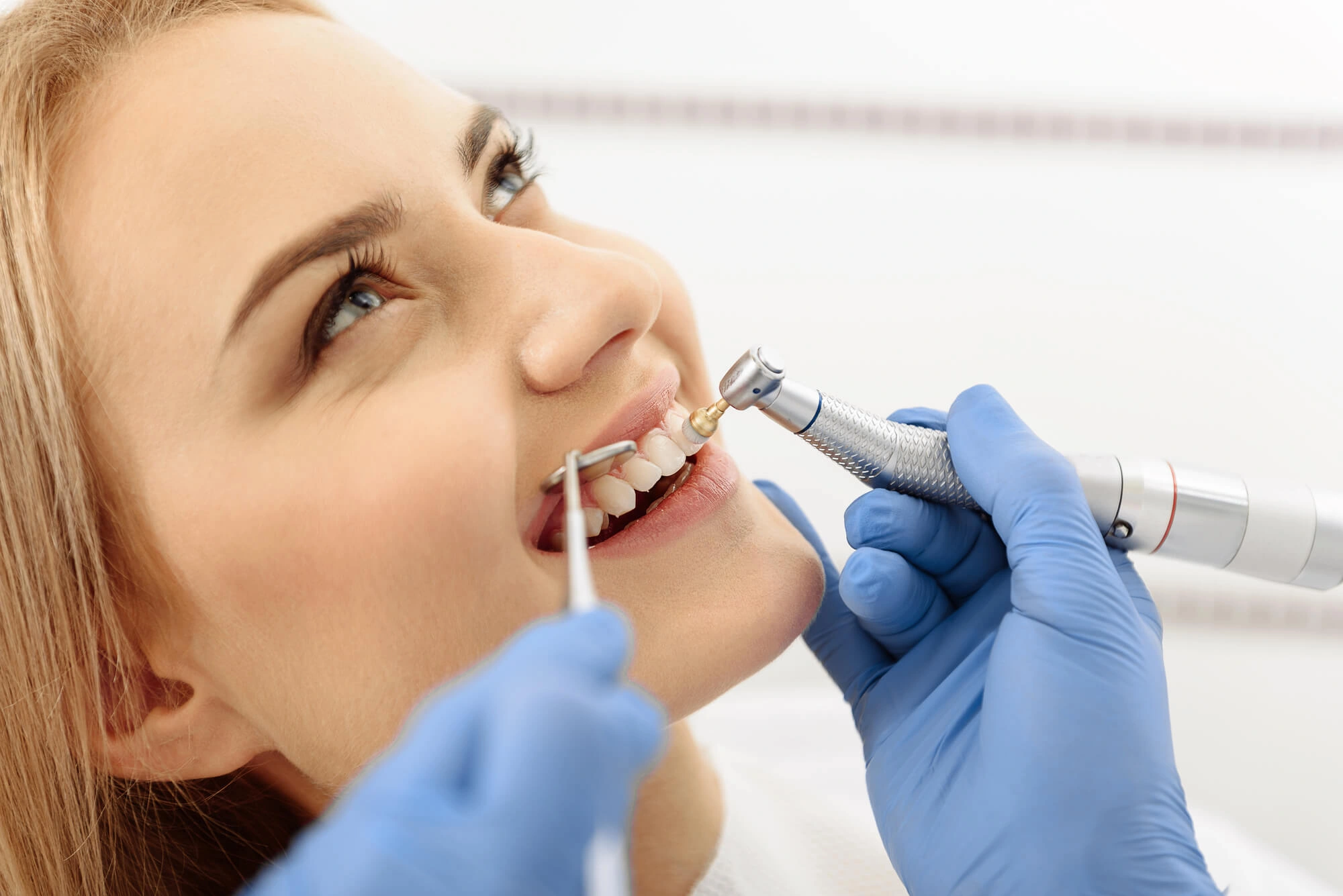 Woman undergoing teeth cleaning charlotte nc
