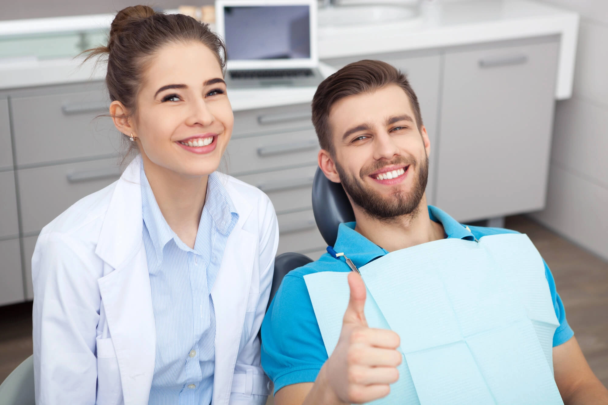 Man smiling with emergency dentist in Steele Creek 