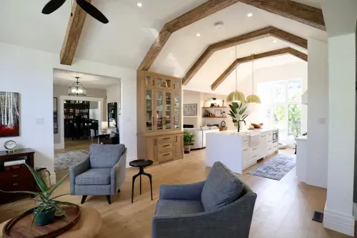 Grey great room furniture with high ceilings and wooden beams