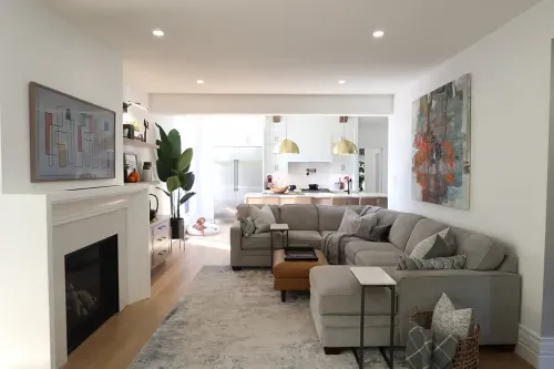 Living space with sectional, fireplace, and patio doors