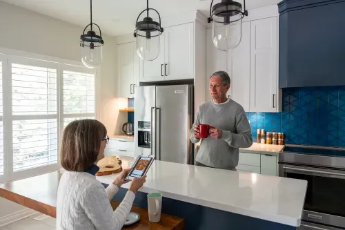 Homeowners having coffee together at their kitchen island