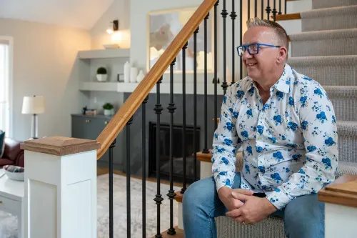 Homeowner sitting on stairs