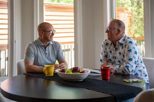 Homeowners sitting together at kitchen table