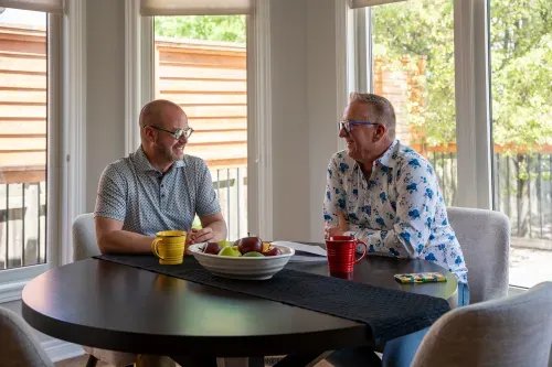 Homeowners sitting together at dining table