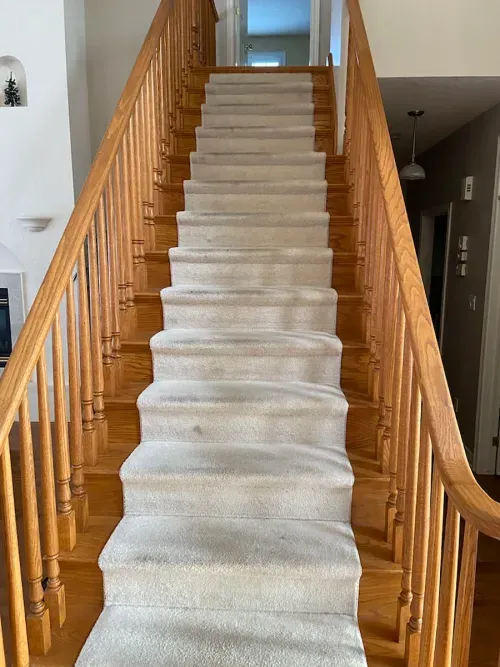 Before photo: wooden staircase front view