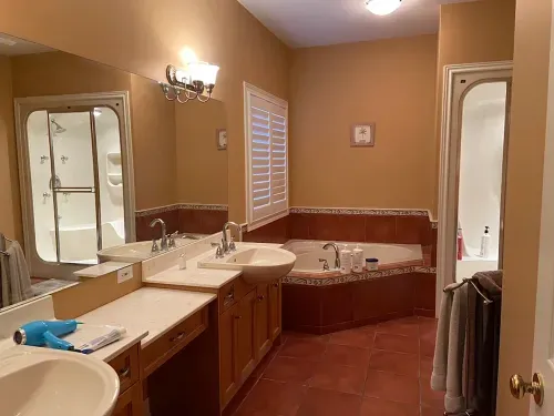 Before image: dark bathroom with wooden accents