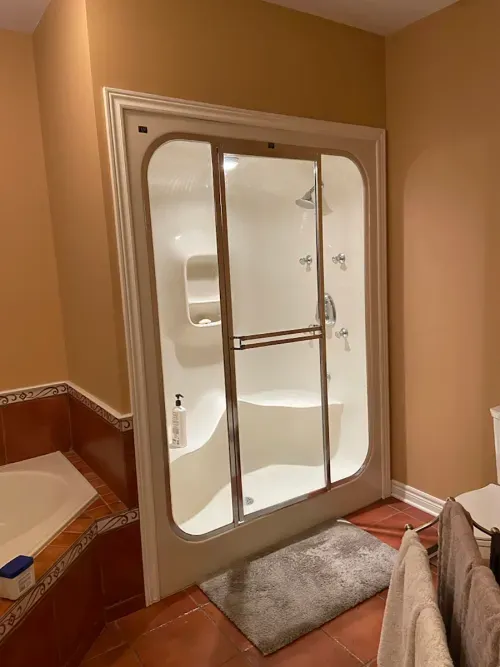 Before image: dark bathroom shower