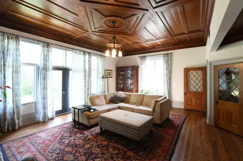 Living room space with ornate wooden living room ceiling