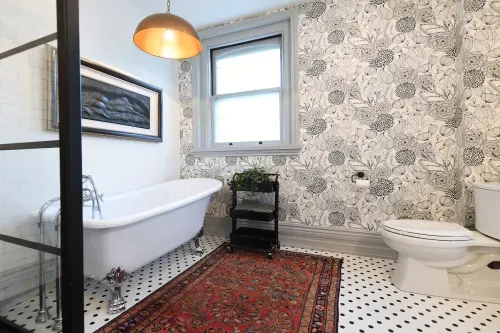 Bathroom with black and white floral wallpaper