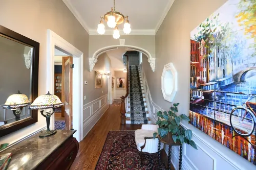 Grand foyer entrance with grand staircase leading upstairs