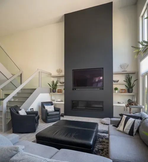 Living room with large fireplace and accent wall