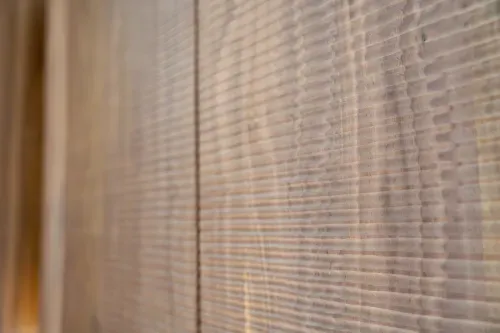 Detailed close up of textured woodgrain on cabinet face