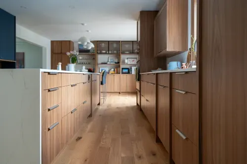 Detail shot of cabinetry drawer pulls, wooden floor