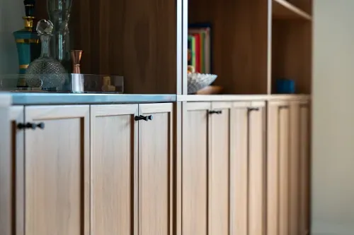Close up of wooden cabinets and door pulls