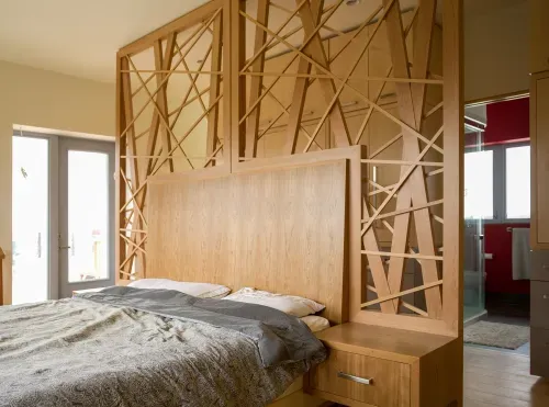 Ornate custom wood headboard with built in shelving